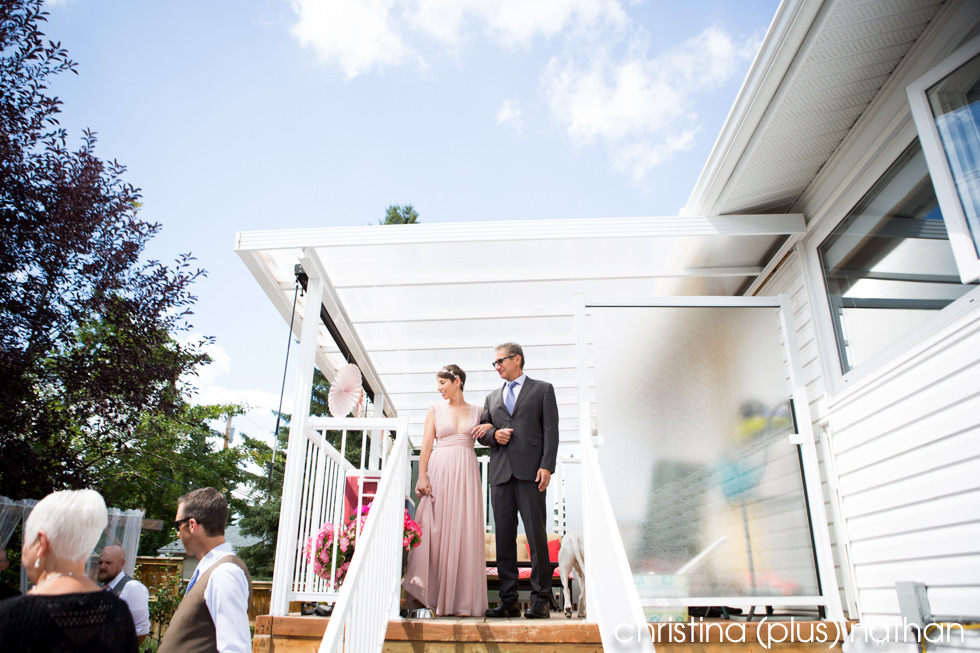 Bride and father coming down isle before wedding ceremony