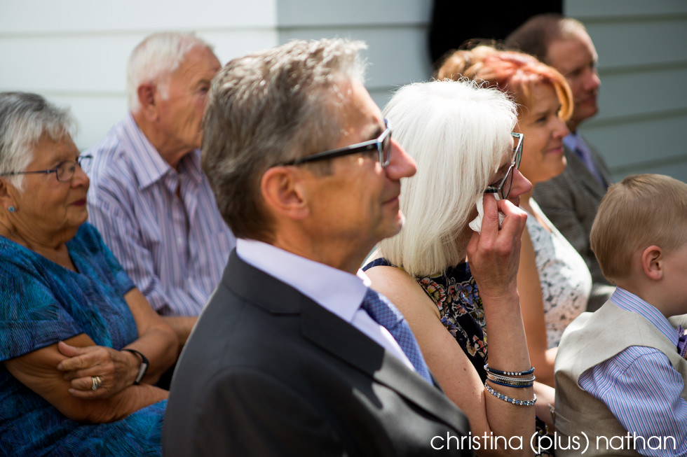 Photograph of mother of the bride getting emotional during wedding ceremony