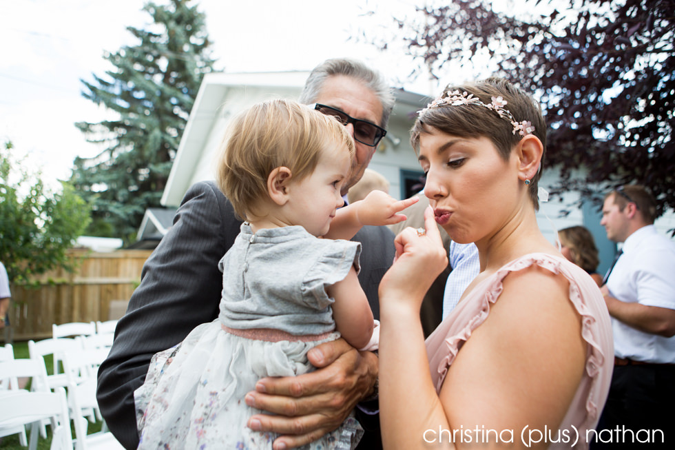 Candid moment with bride and flower girl after the wedding ceremony