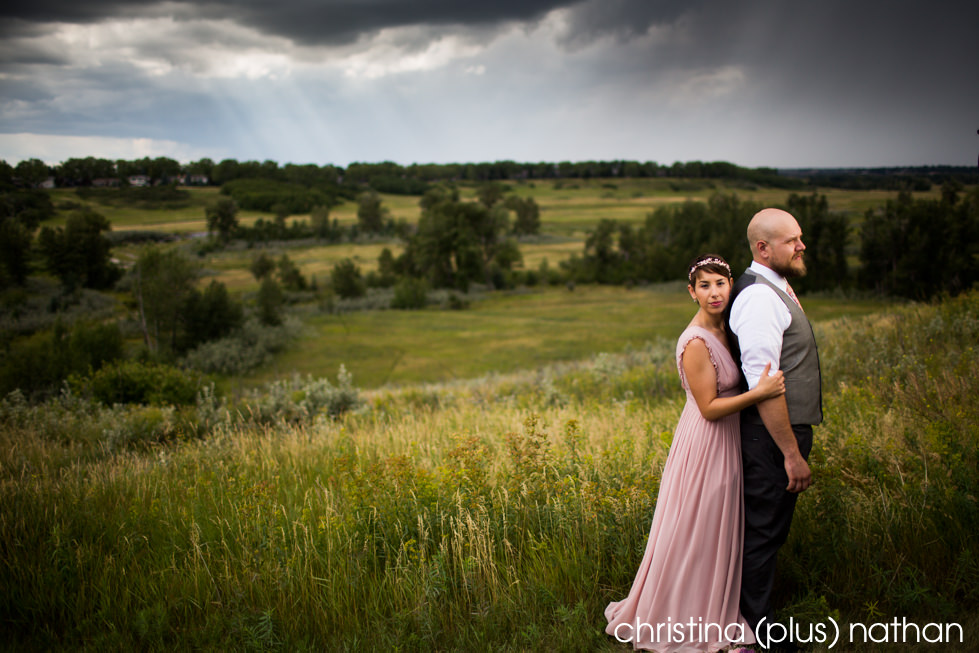 Vintage looking pink wedding dress overlooking Fishcreek Park in Calgary