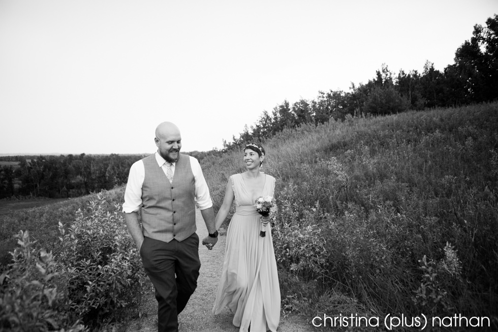 Black and White photography of Bride and Groom happily walking