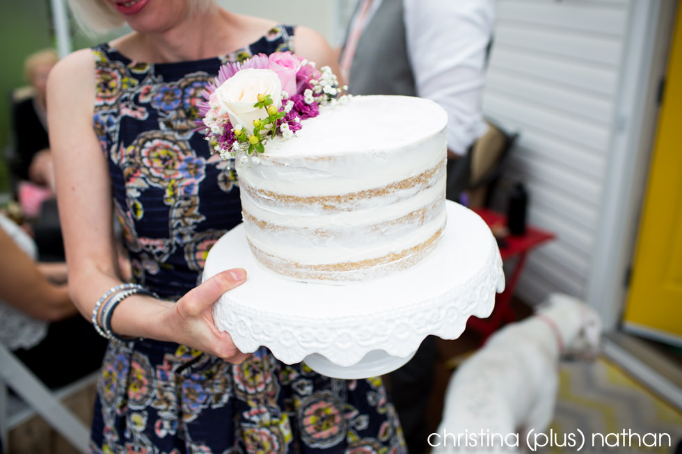 Mother of the bride is serving Naked cake that is homemade for the wedding