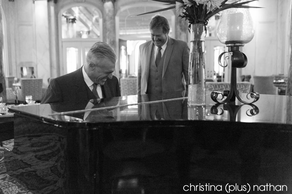 Groom has a laugh with his best man before his Bow Valley Ranche wedding